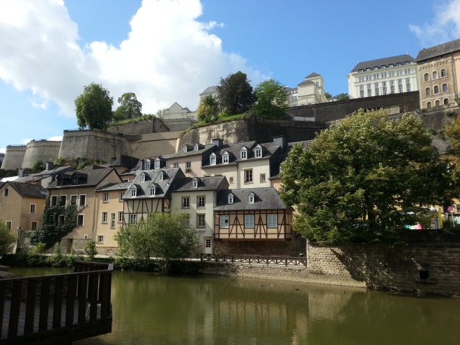 Lovely houses and trees were reflected on the calm water in Grund in Luxembourg
