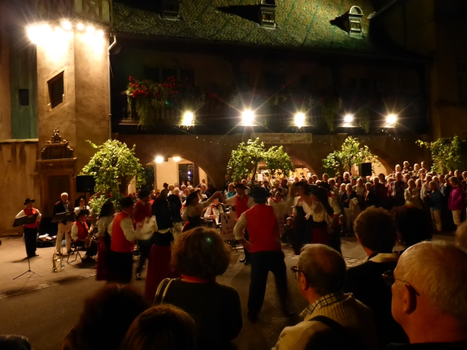 Weekly folklore music and dancing in the street in Colmar