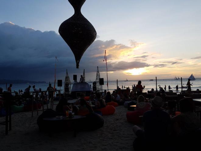 Relaxing mood sitting in a bean bag at the beach. Boracay Island, The Philippines