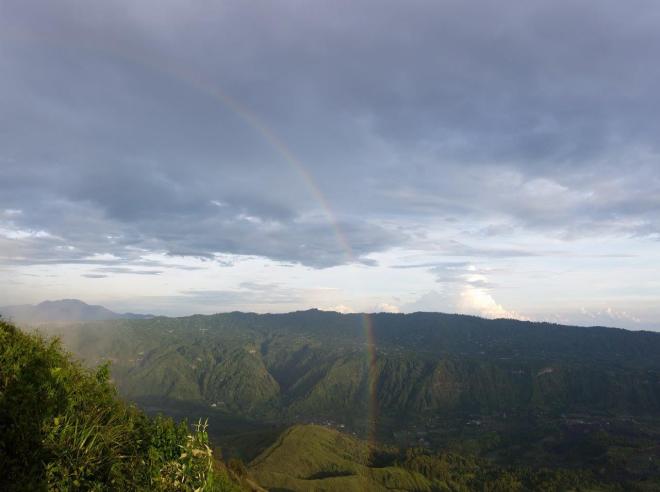 Rainbow over Batur Volcano. Bali, Indonesia.